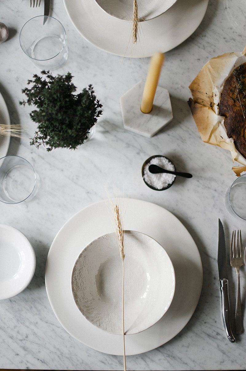 marble table with white place setting dinner wit & delight